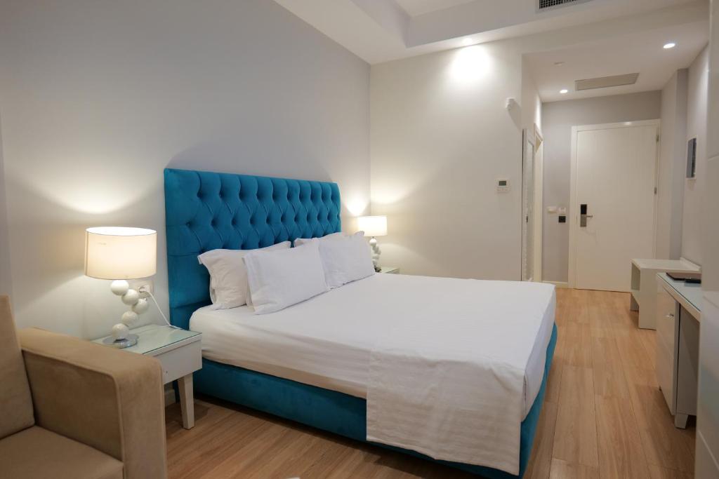 Postel nebo postele na pokoji v ubytování Hotel Luxury