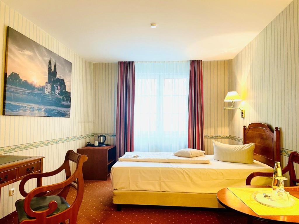 Postel nebo postele na pokoji v ubytování Mercure Hotel Plaza Magdeburg