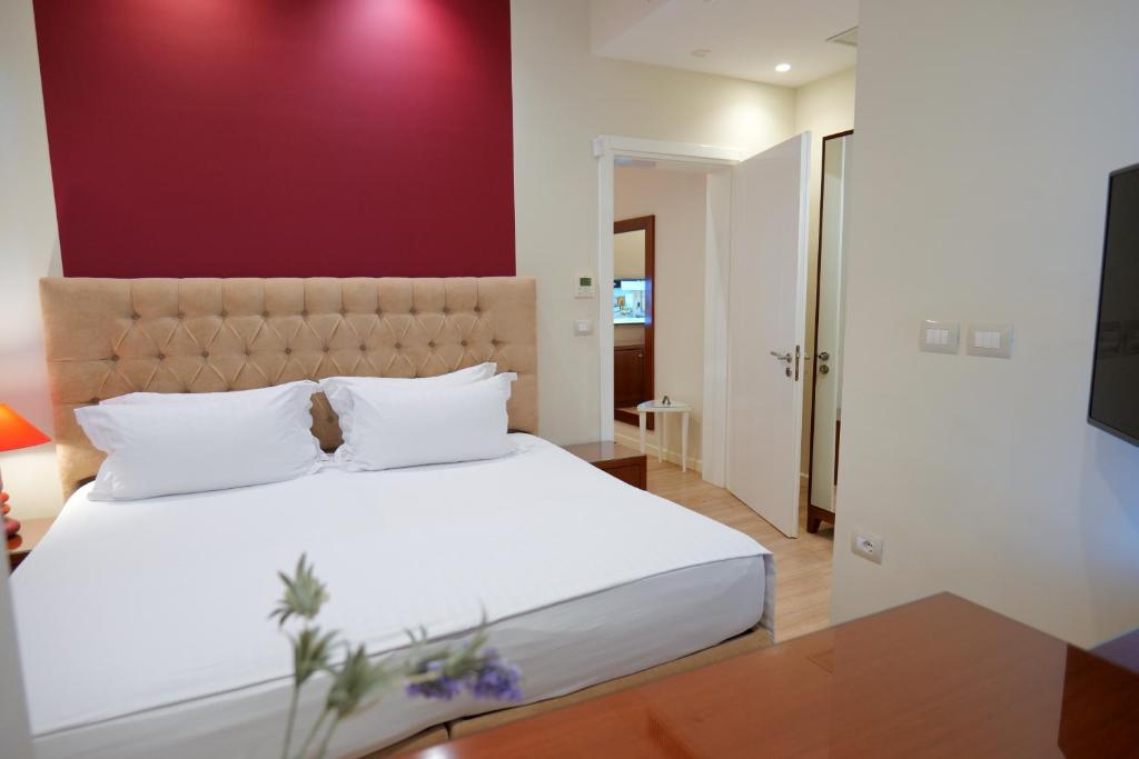 Postel nebo postele na pokoji v ubytování Hotel Luxury
