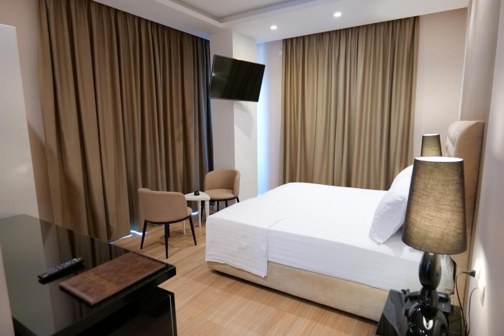 Postel nebo postele na pokoji v ubytování Hotel Luxury