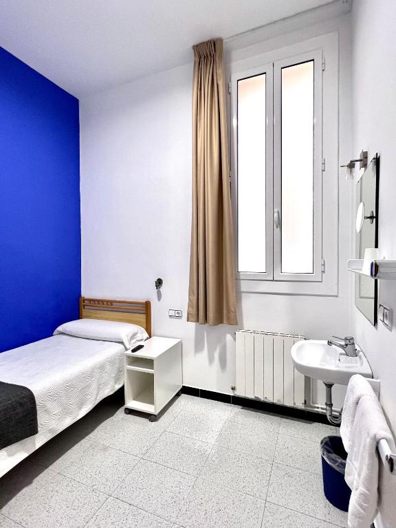 Postel nebo postele na pokoji v ubytování Pensión Peiró