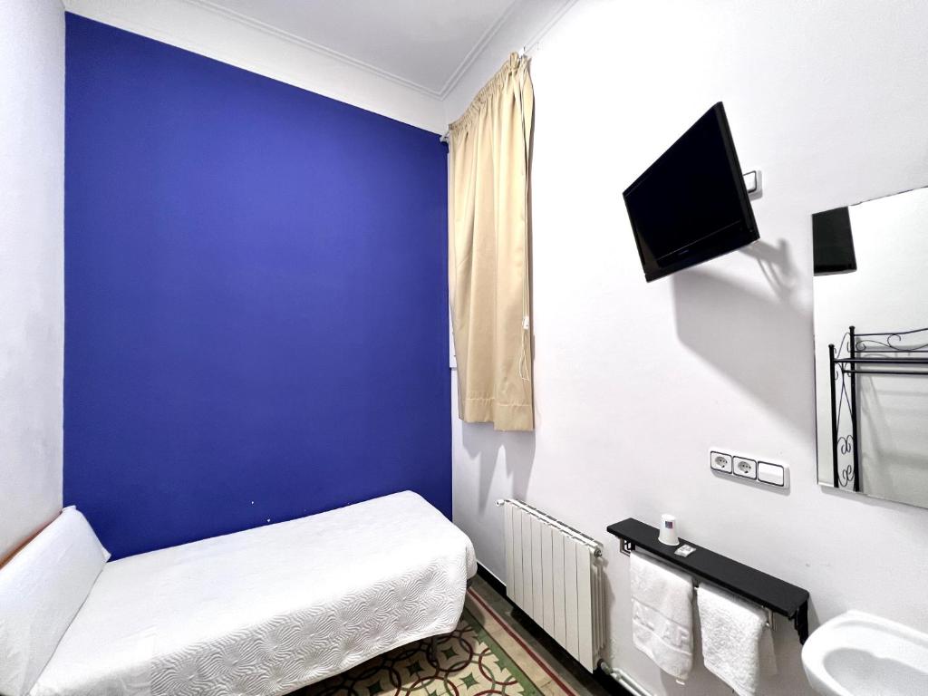 Postel nebo postele na pokoji v ubytování Pensión Peiró
