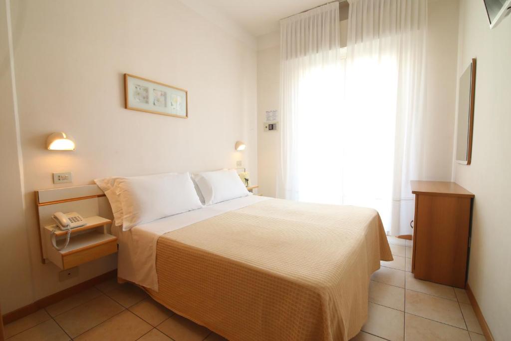 Postel nebo postele na pokoji v ubytování Hotel Soave