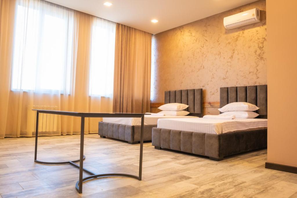 Postel nebo postele na pokoji v ubytování B H Y Guesthouse in Yerevan