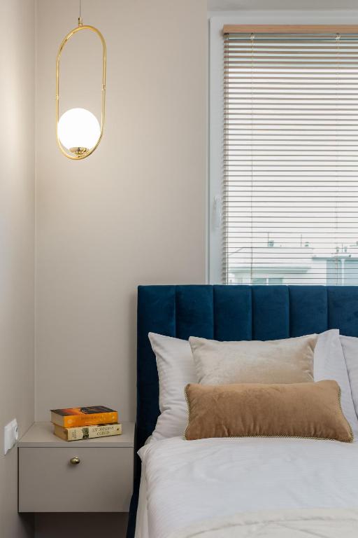 Posteľ alebo postele v izbe v ubytovaní Seaside Apartamenty Porta Mare I Kołobrzeg