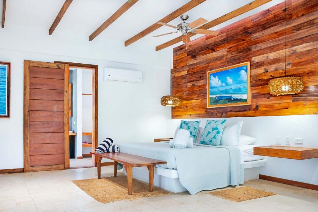 a living room with a couch and a table at Miraflores Boutique Hotel Adults Only in San Andrés