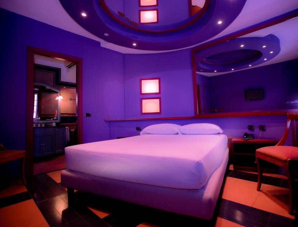 Postel nebo postele na pokoji v ubytování Motel Hotel Charlie