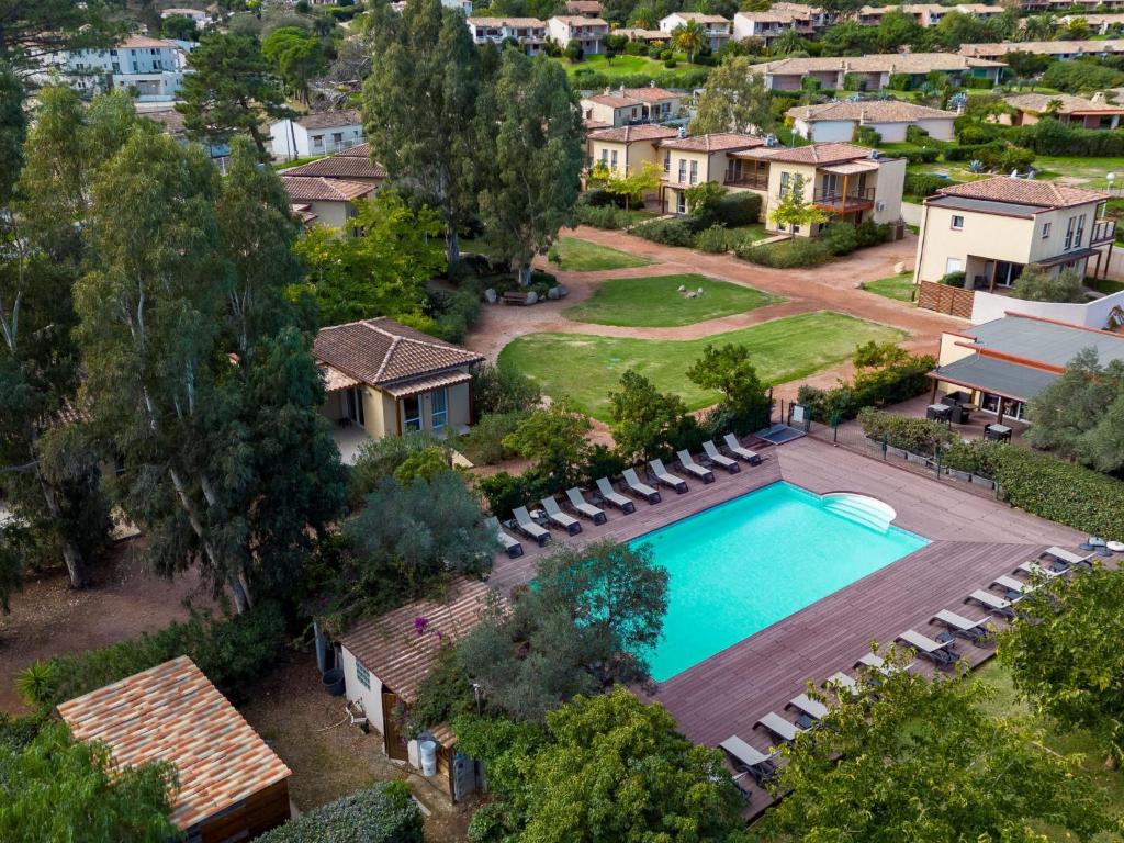 an aerial view of a house with a swimming pool at Apartment Residence Marina di Favone- T3- 4-6 pers-2 by Interhome in Favone