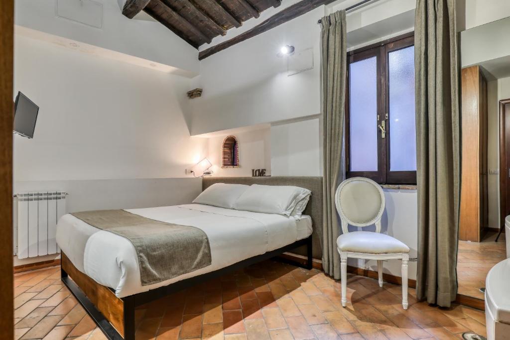 Un ou plusieurs lits dans un hébergement de l'établissement Luxury Navona