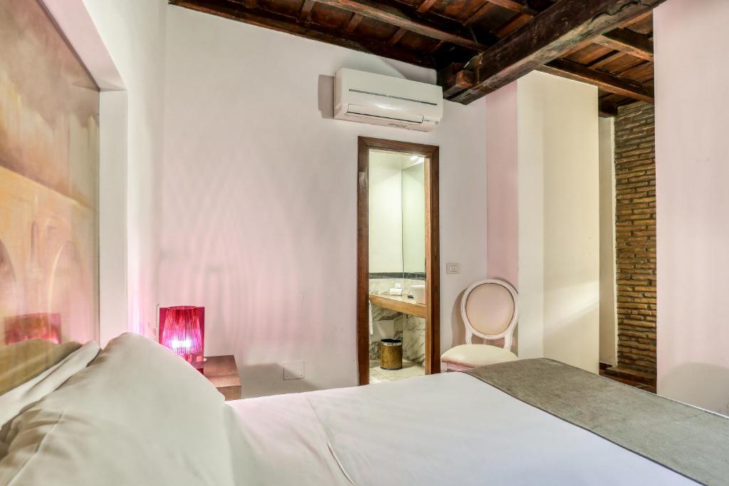 Un ou plusieurs lits dans un hébergement de l'établissement Luxury Navona