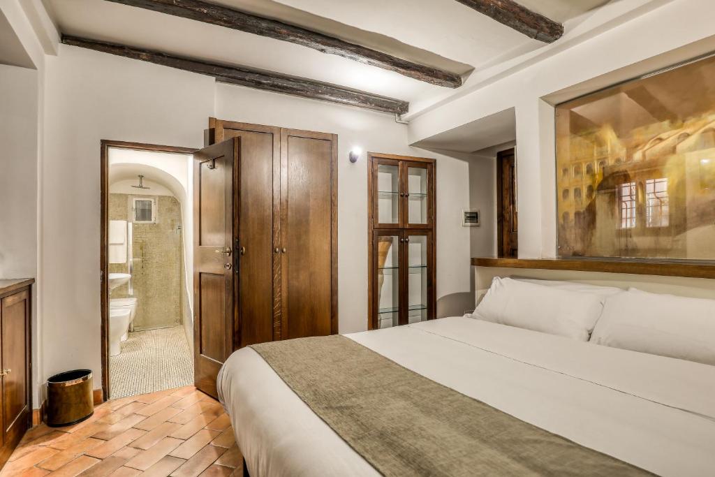 Un ou plusieurs lits dans un hébergement de l'établissement Luxury Navona