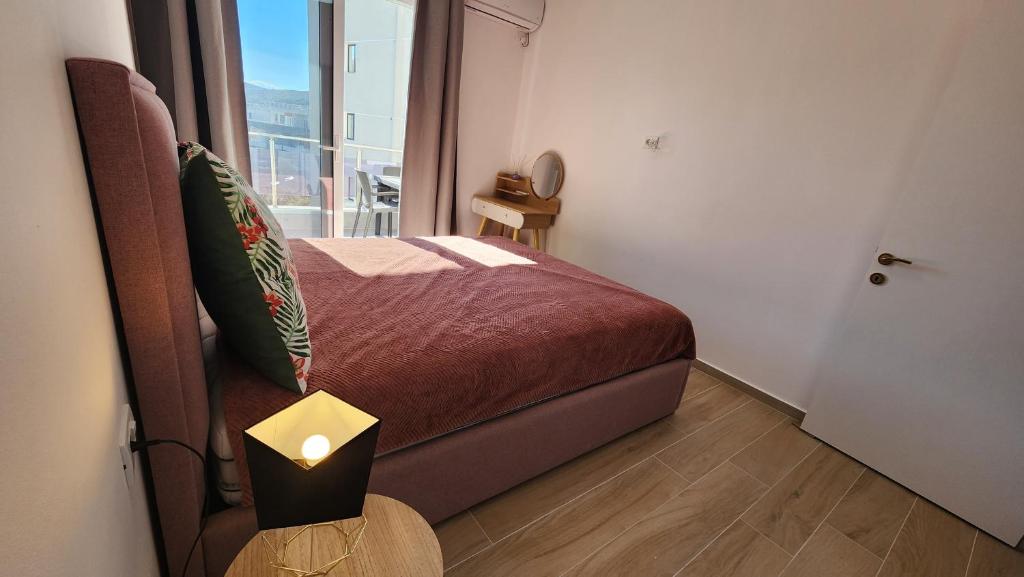 A bed or beds in a room at Jusal Sea View Apartment
