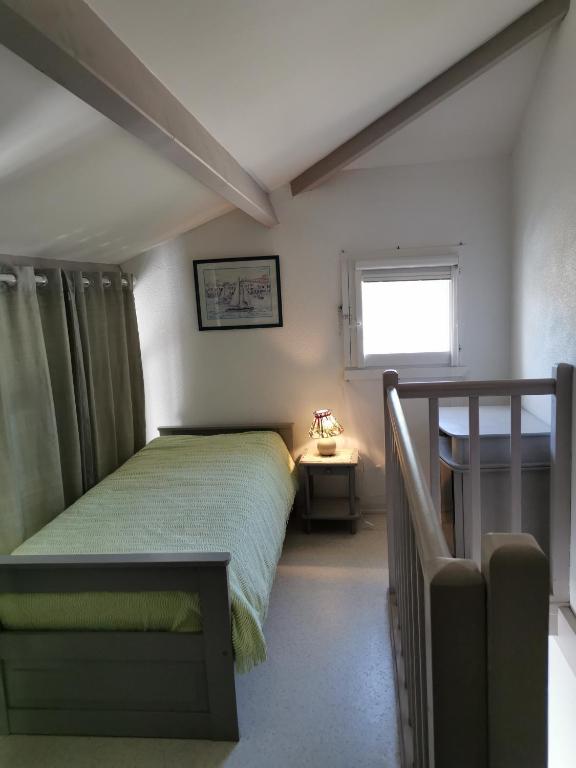 Posteľ alebo postele v izbe v ubytovaní Le Cosy d'Eden