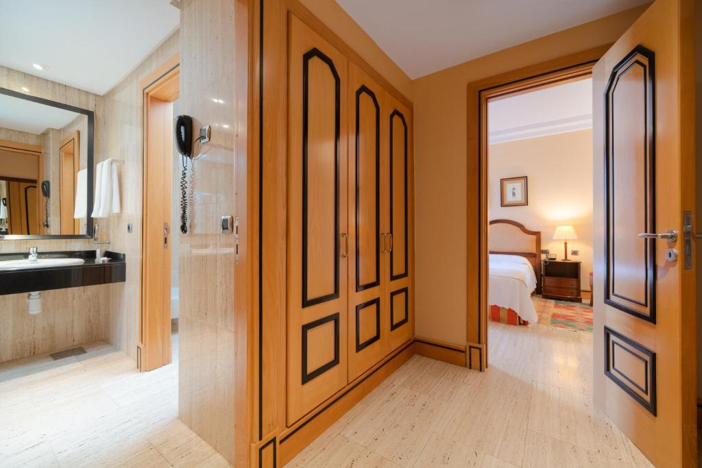 a bathroom with a door leading to a bedroom at Villa VIK - Hotel Boutique in Arrecife