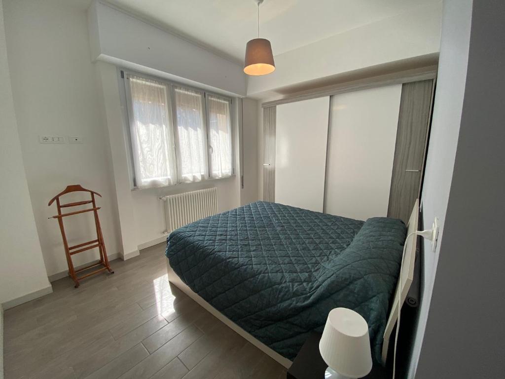 A bed or beds in a room at Gianluca Apartments 7