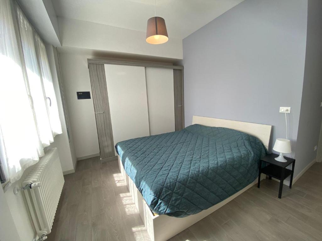 A bed or beds in a room at Gianluca Apartments 7