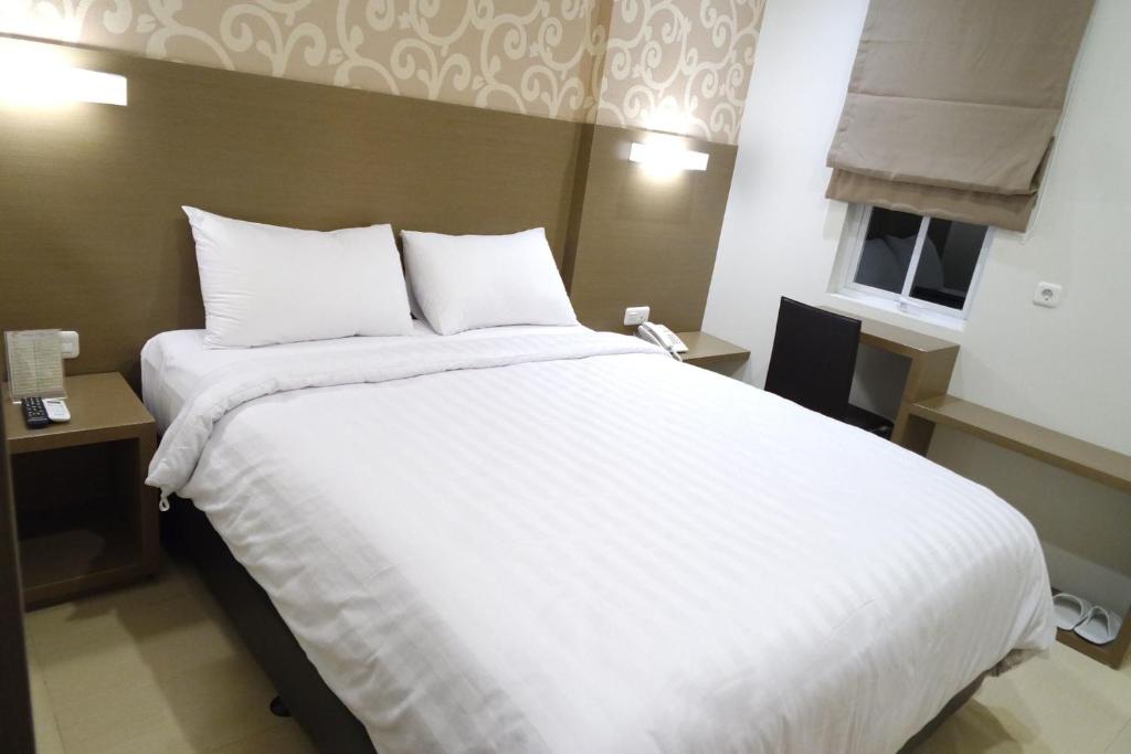 Postelja oz. postelje v sobi nastanitve Yokotel Hotel