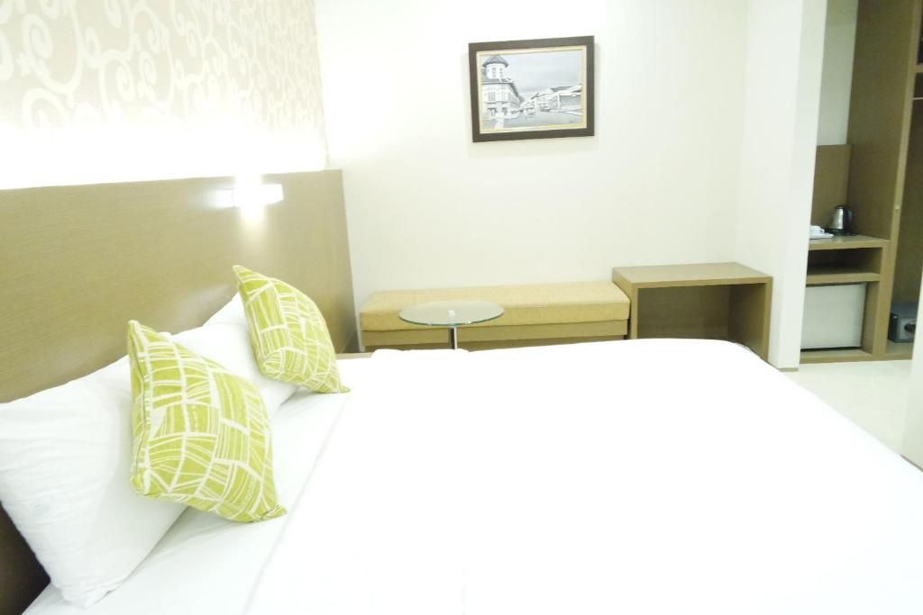 Postelja oz. postelje v sobi nastanitve Yokotel Hotel