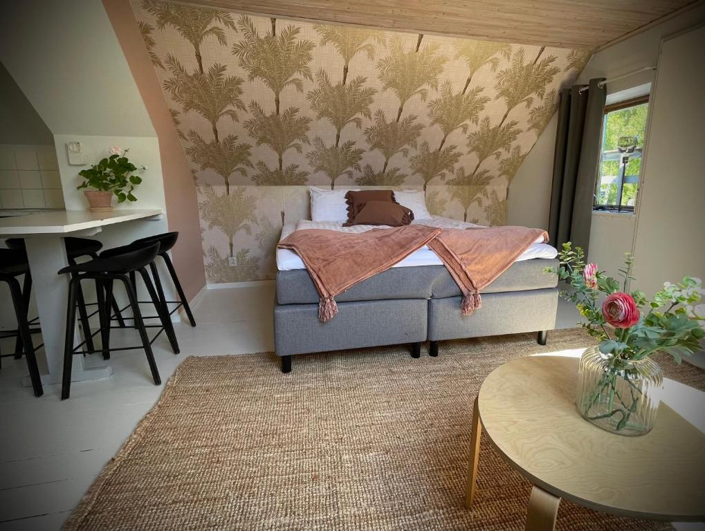 Postel nebo postele na pokoji v ubytování Gåsen Out B&B