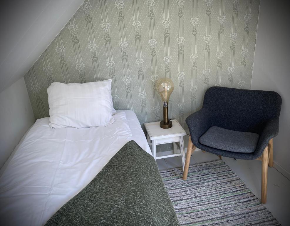 Postel nebo postele na pokoji v ubytování Gåsen Out B&B