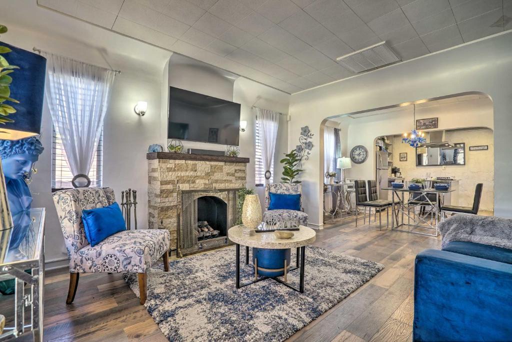 a living room with a couch and a fireplace at Pet-Friendly El Paso Escape with Patio and Grill! in El Paso