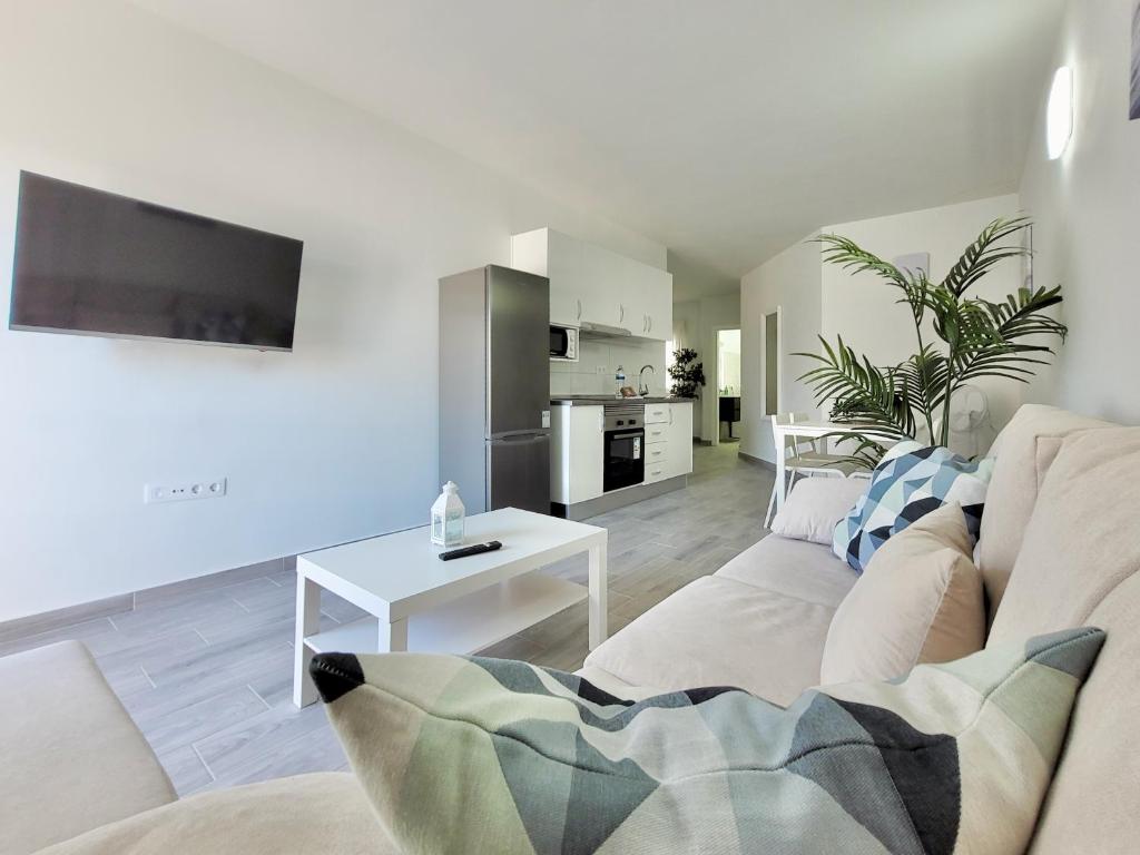 Telewizja i/lub zestaw kina domowego w obiekcie La Hoya 29 Apartments