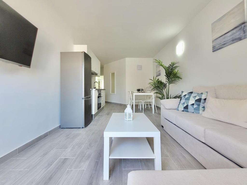 Telewizja i/lub zestaw kina domowego w obiekcie La Hoya 29 Apartments