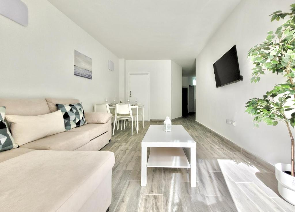 Telewizja i/lub zestaw kina domowego w obiekcie La Hoya 29 Apartments