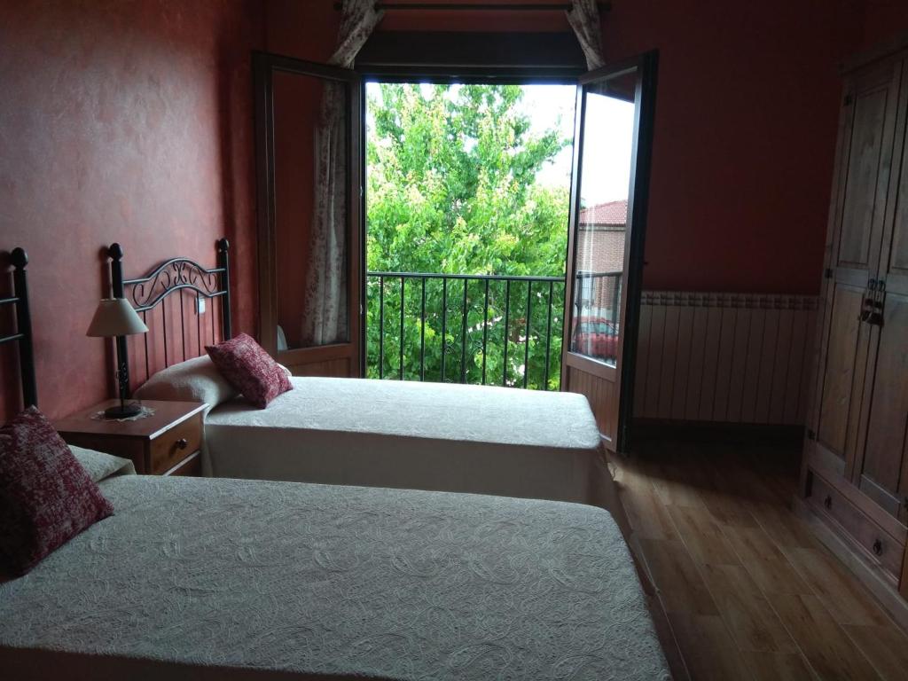 Postel nebo postele na pokoji v ubytování LA QUEDADA DE NAVA
