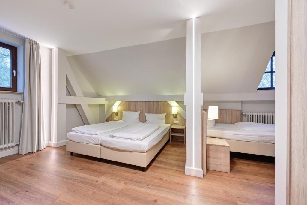 Postel nebo postele na pokoji v ubytování Hotel Schleuse