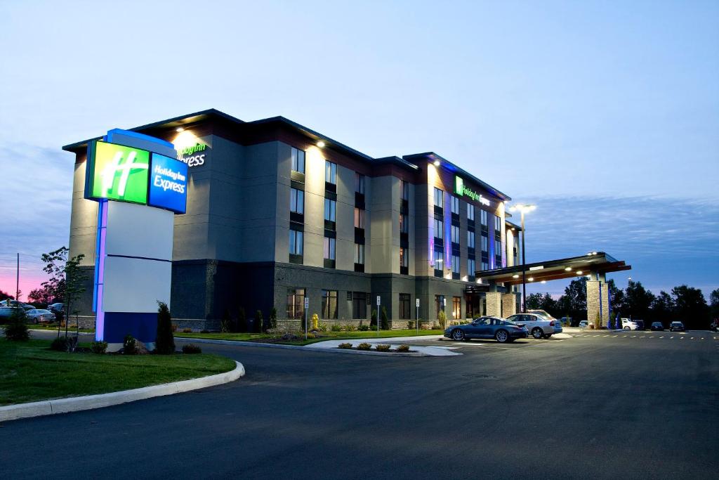 a large building with a parking lot in front of it at Holiday Inn Express Pembroke, an IHG Hotel in Pembroke