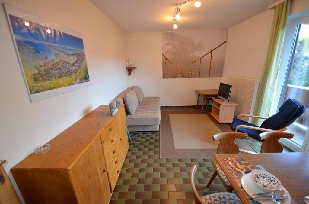 a living room with a couch and a table at Appartment Stepanek in Saalbach Hinterglemm