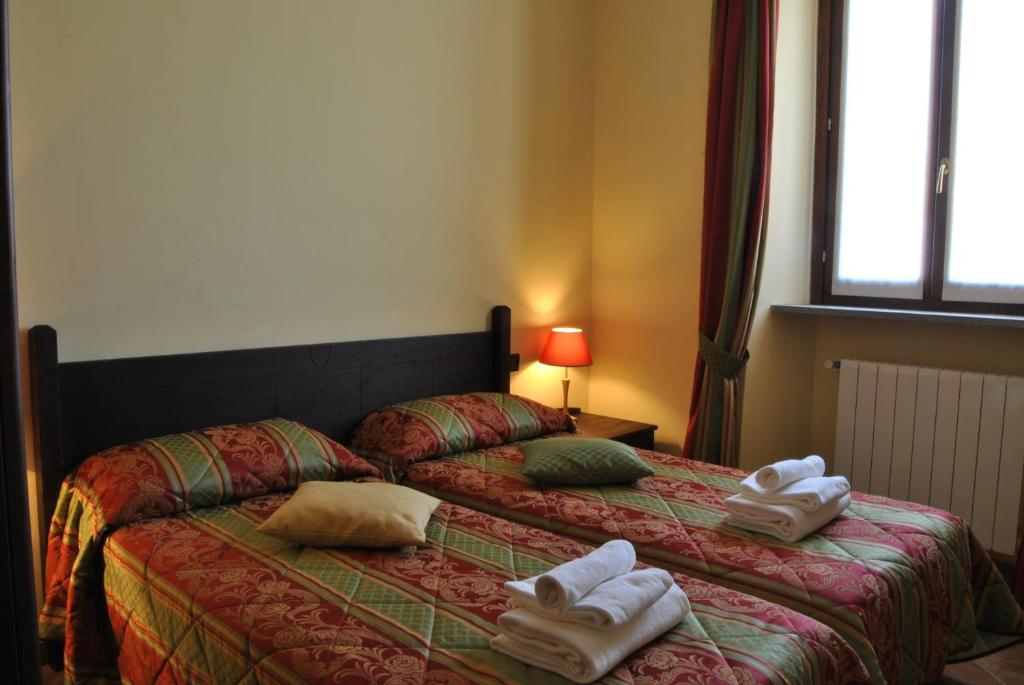 Postel nebo postele na pokoji v ubytování Hotel Oberje Dla Viere
