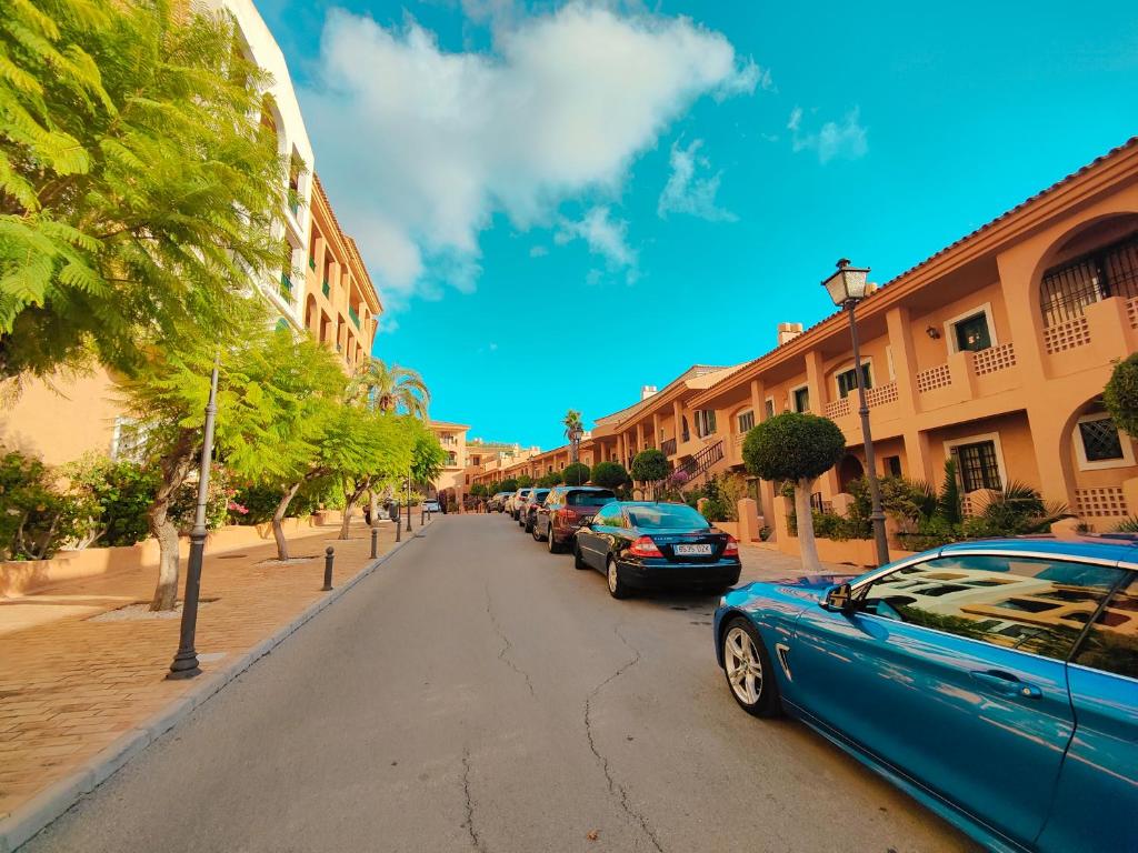 a blue car parked on the side of a street at Luxury Apartments Mascarat in Altea