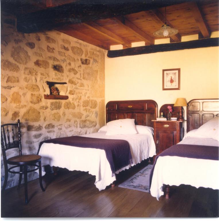 Postel nebo postele na pokoji v ubytování Posada El Prado Mayor
