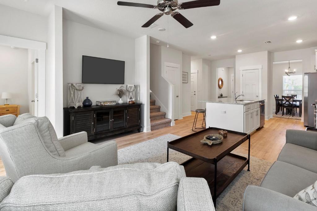 a living room with a couch and a table at Serenity Salty Intentions At 14334 Gardenglen Drive in Pensacola