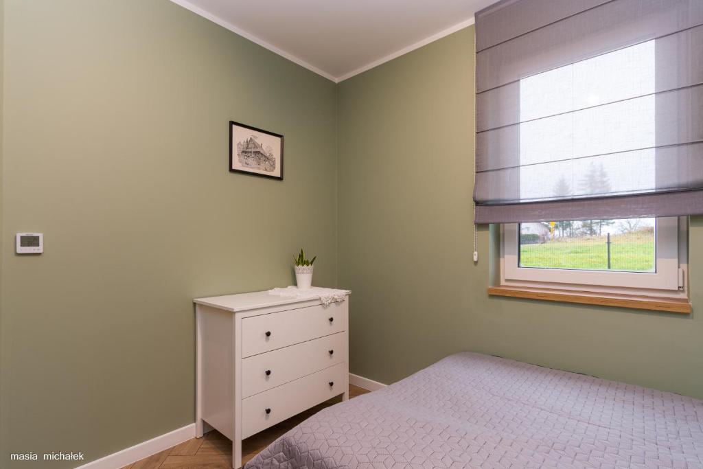 Łóżko lub łóżka w pokoju w obiekcie DAJ SOBIE CZAS Apartament