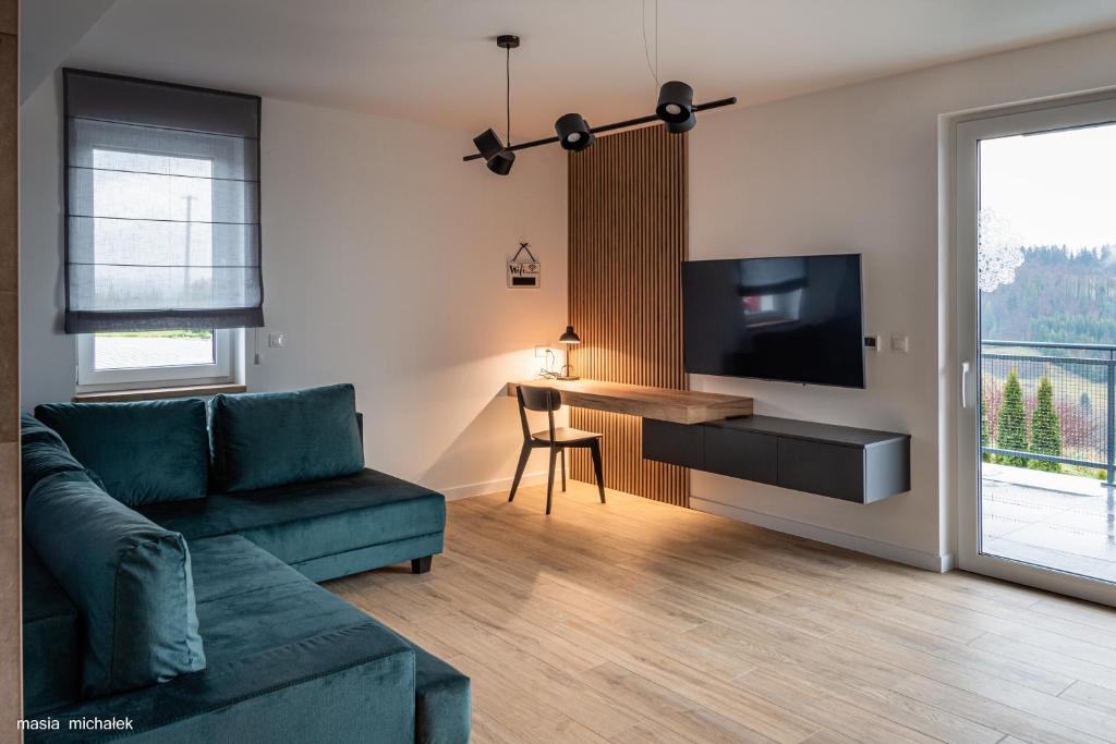 Telewizja i/lub zestaw kina domowego w obiekcie DAJ SOBIE CZAS Apartament