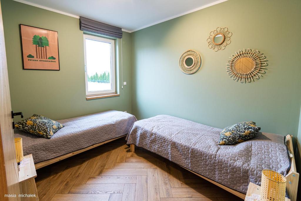 Łóżko lub łóżka w pokoju w obiekcie DAJ SOBIE CZAS Apartament