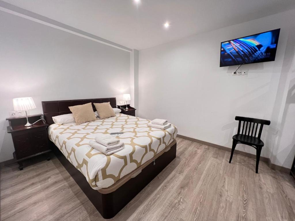 A bed or beds in a room at Nuestro Rinconcito del Soho