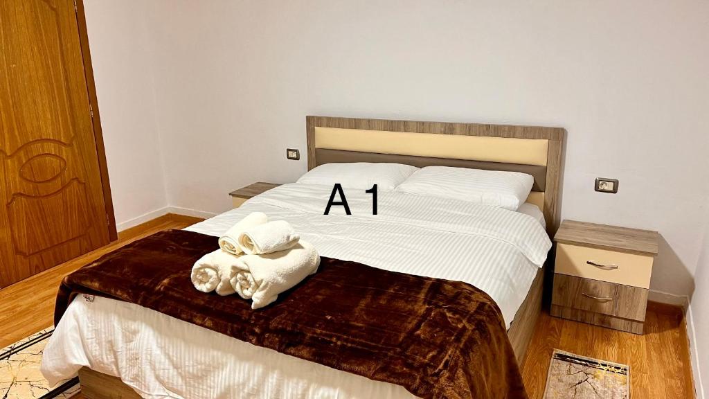 Postel nebo postele na pokoji v ubytování Dritëza