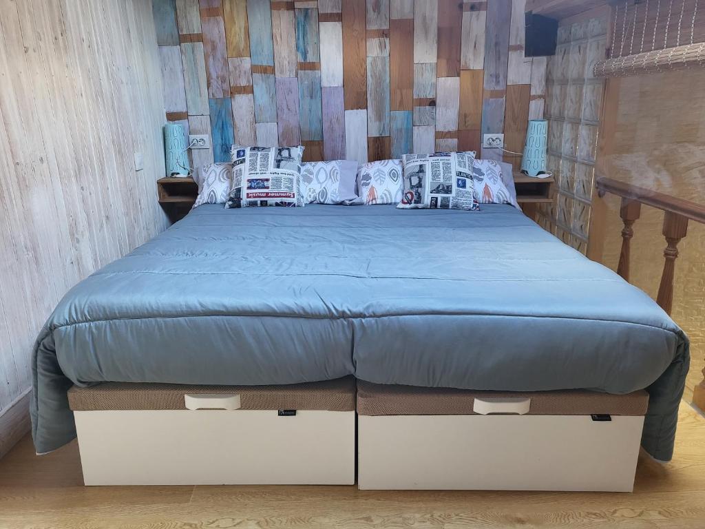 A bed or beds in a room at Apartamento Santa Agueda