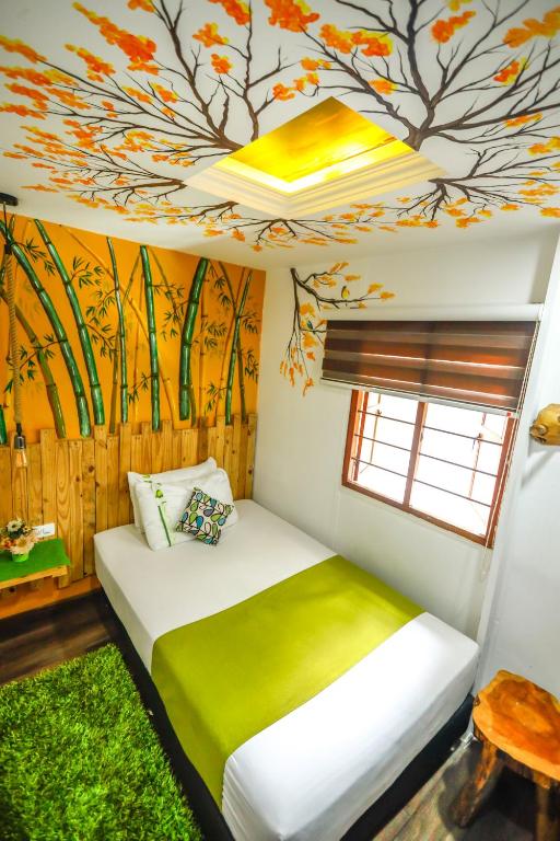 Uma cama ou camas num quarto em The Garden Lleras 10