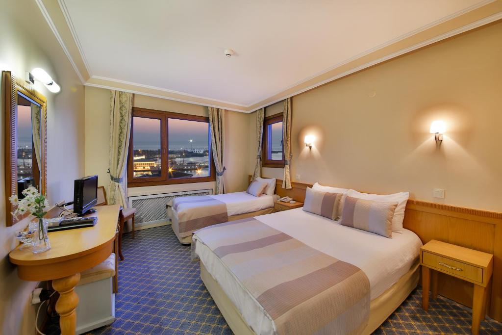 Postel nebo postele na pokoji v ubytování Sidonya Hotel