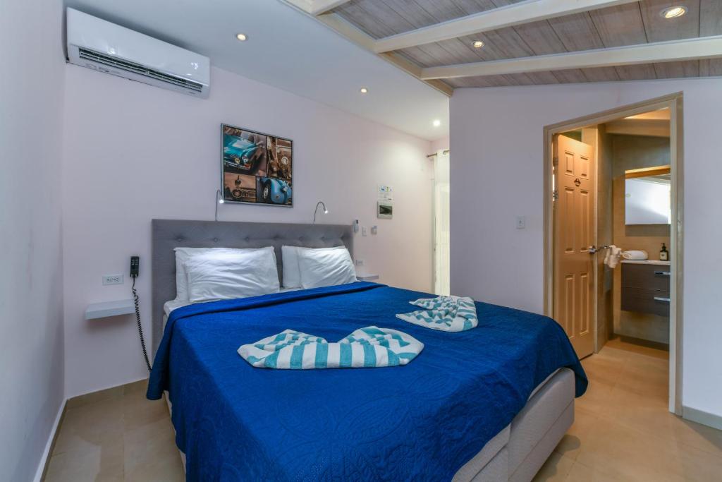 Postel nebo postele na pokoji v ubytování Boutique Hotel Swiss Paradise Aruba Villas and Suites