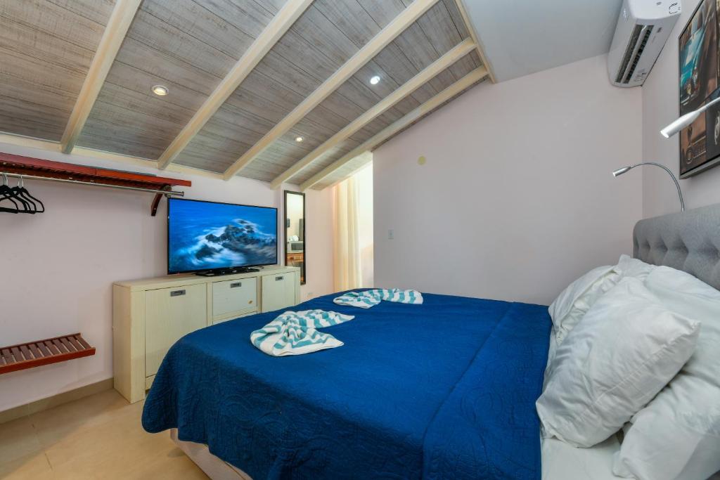 Postel nebo postele na pokoji v ubytování Boutique Hotel Swiss Paradise Aruba Villas and Suites