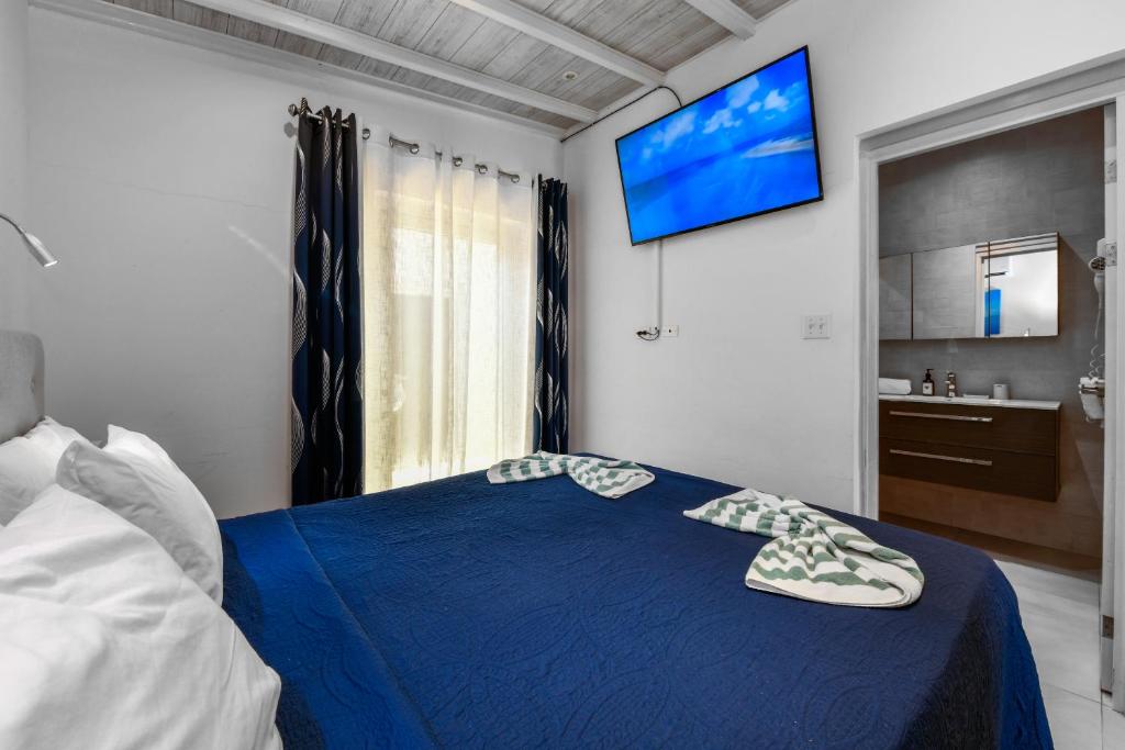 Postel nebo postele na pokoji v ubytování Boutique Hotel Swiss Paradise Aruba Villas and Suites