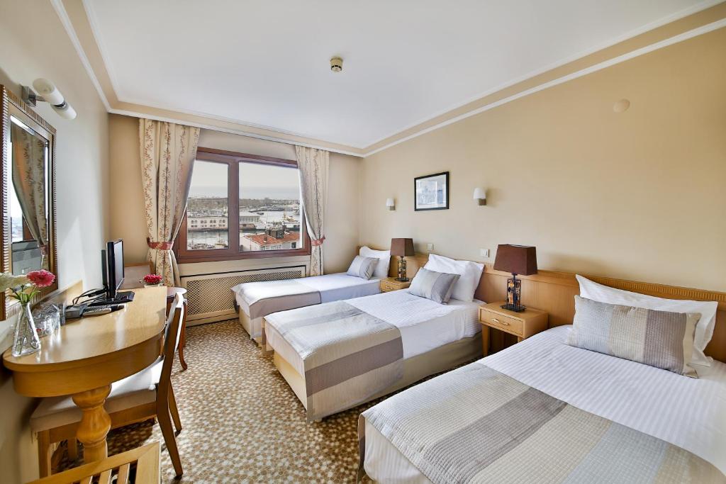 Postel nebo postele na pokoji v ubytování Sidonya Hotel