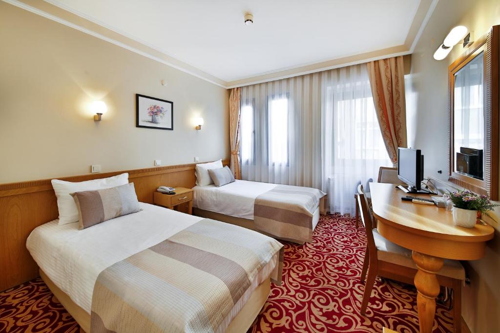 Postel nebo postele na pokoji v ubytování Sidonya Hotel