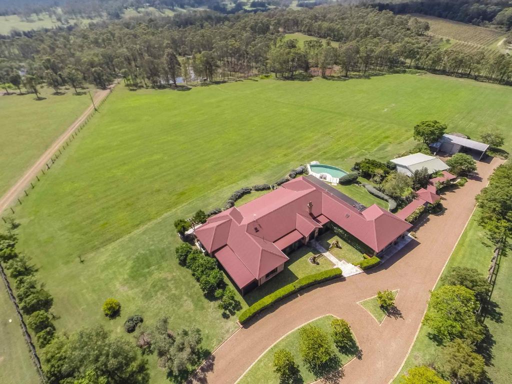 an aerial view of a large estate with a pink house at The Ballabourneen Estate in Lovedale